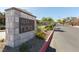 The stone monument entrance to the Alta Fiore community features lush landscaping and a glimpse of the gated entrance at 16 Cresta Villa Ct, Henderson, NV 89011