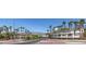 View of the Lake Las Vegas community sign with bridge, palm trees, and entrance at 16 Cresta Villa Ct, Henderson, NV 89011