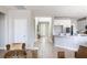 Open-concept entryway leads to a modern kitchen with a peninsula island and stainless appliances at 16 Cresta Villa Ct, Henderson, NV 89011