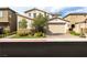 Inviting two-story home featuring a well-maintained front yard and neutral color scheme at 16 Cresta Villa Ct, Henderson, NV 89011