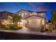 Attractive two-story home showcasing a well-maintained exterior, a two car garage, and manicured landscaping at 16 Cresta Villa Ct, Henderson, NV 89011