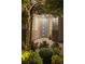 Inviting front entrance with modern door, lighting, and lush landscaping at 16 Cresta Villa Ct, Henderson, NV 89011