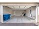 Spacious three-car garage with epoxy flooring, overhead storage, and utility connections at 16 Cresta Villa Ct, Henderson, NV 89011