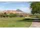 Lush green golf course meanders through upscale homes and desert landscape, offering a scenic backdrop at 16 Cresta Villa Ct, Henderson, NV 89011