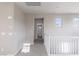 Hallway leading to bathroom with thermostat and view into the bathroom at 16 Cresta Villa Ct, Henderson, NV 89011