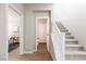 Hallway with staircase, office, and bathroom access at 16 Cresta Villa Ct, Henderson, NV 89011