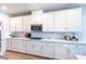 Beautiful kitchen with updated backsplash, stainless steel appliances and white cabinets at 16 Cresta Villa Ct, Henderson, NV 89011