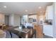 Bright, open-concept kitchen featuring stainless steel appliances and a large island, connected to the dining area at 16 Cresta Villa Ct, Henderson, NV 89011