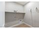 A neutral laundry room offers a shelf and rack at 16 Cresta Villa Ct, Henderson, NV 89011