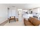 Bright and airy living room with hardwood floors, modern furnishings, and an open floor plan at 16 Cresta Villa Ct, Henderson, NV 89011