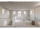 Bright loft area with white railings, carpeted floor, and seating at 16 Cresta Villa Ct, Henderson, NV 89011