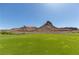 Picturesque mountain views serve as a backdrop to this expansive golf course and desert landscape at 16 Cresta Villa Ct, Henderson, NV 89011