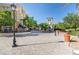 Charming town center with European-style buildings, outdoor seating, and lush landscaping at 16 Cresta Villa Ct, Henderson, NV 89011
