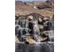 Beautiful cascading water feature with natural stone and lush surroundings at 16 Cresta Villa Ct, Henderson, NV 89011