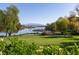 Expansive water view with boats docked, surrounded by lush greenery and distant mountains at 16 Cresta Villa Ct, Henderson, NV 89011