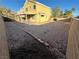 Backyard with desert landscaping, perimeter fencing, covered patio and views of the neighborhood at 161 Lenape Heights Ave, Las Vegas, NV 89148