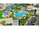 Aerial view of community pool, waterpark, tennis courts, and basketball court in a neighborhood at 161 Lenape Heights Ave, Las Vegas, NV 89148