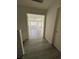 Hallway view leads to a bright living space with laminate flooring and natural light at 161 Lenape Heights Ave, Las Vegas, NV 89148