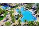 An aerial view of a large pool surrounded by lush palm trees and landscaping at 161 Lenape Heights Ave, Las Vegas, NV 89148
