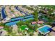 Aerial view showcases community tennis courts, pool, playground, and lush landscaping at 161 Lenape Heights Ave, Las Vegas, NV 89148