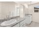 Modern bathroom features granite countertops, dual sinks, and well-lit mirrors for a spa-like experience at 1783 Matteo Cove Pl, North Las Vegas, NV 89084