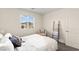 Bright bedroom with a large window, ladder with blankets, and neutral-toned furniture at 1783 Matteo Cove Pl, North Las Vegas, NV 89084