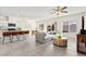 Bright open-concept living room featuring modern kitchen, breakfast bar, and comfortable seating area at 1783 Matteo Cove Pl, North Las Vegas, NV 89084