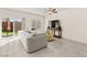 Bright living room with sliding glass doors and backyard view, comfortable seating, and media center at 1783 Matteo Cove Pl, North Las Vegas, NV 89084