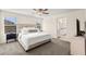 Spacious main bedroom with plush carpet, ceiling fan, and ensuite bathroom access at 1783 Matteo Cove Pl, North Las Vegas, NV 89084