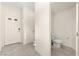 Small powder room with tile floors, toilet, and access to hall at 1783 Matteo Cove Pl, North Las Vegas, NV 89084