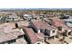 An aerial view of an established community showcasing terra cotta roofs and manicured landscaping at 182 Robledo St, Las Vegas, NV 89138