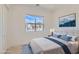 Bedroom featuring large window and bed with stylish mountain view at 182 Robledo St, Las Vegas, NV 89138