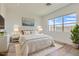 Bright bedroom with large window, a comfortable queen size bed and decorative artwork at 182 Robledo St, Las Vegas, NV 89138