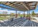 Community outdoor seating area with covered trellis and tables in a common area at 182 Robledo St, Las Vegas, NV 89138