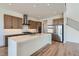 Bright kitchen with a large island, stainless steel appliances, and wooden cabinets at 182 Robledo St, Las Vegas, NV 89138