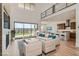 Bright, open living room with modern furnishings, fireplace and backyard views to outdoor space at 182 Robledo St, Las Vegas, NV 89138