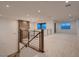 Loft features plush carpeting, contemporary lighting, and expansive windows for ample natural light at 182 Robledo St, Las Vegas, NV 89138