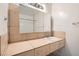 Tiled bathroom vanity with large mirror and ample counter space showcasing a functional design at 212 Orland St # 19, Las Vegas, NV 89107