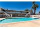 Relaxing apartment community pool with sun deck and nearby palm trees for cooling shade at 212 Orland St # 19, Las Vegas, NV 89107