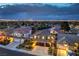 Beautiful aerial view of a suburban home at dusk, showcasing the well-lit community and cityscape at 2248 Verde Cape Ave, Henderson, NV 89052