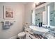 Elegant bathroom featuring modern fixtures, granite countertops, and decorative tiles, offering a luxurious feel at 2248 Verde Cape Ave, Henderson, NV 89052