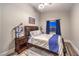 Well-lit bedroom with dark wood furniture and cozy decor at 2248 Verde Cape Ave, Henderson, NV 89052