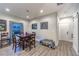 Cozy dining area features natural light, wood floors, and stylish decor creating an inviting atmosphere at 2248 Verde Cape Ave, Henderson, NV 89052