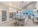 Modern kitchen with stainless steel appliances, pantry, and a large granite island with barstool seating at 2248 Verde Cape Ave, Henderson, NV 89052