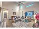 Bright living room showcasing soaring ceilings, hardwood floors, and elegant furnishings at 2248 Verde Cape Ave, Henderson, NV 89052
