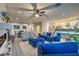 Bright and airy living room flows to the kitchen and features stylish furniture at 2248 Verde Cape Ave, Henderson, NV 89052