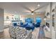Bright open concept living room featuring modern decor, fireplace, and seamless access to the outdoor pool area at 2248 Verde Cape Ave, Henderson, NV 89052