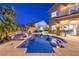 Backyard pool and spa area with lush tropical landscaping at 2248 Verde Cape Ave, Henderson, NV 89052