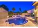 Inviting backyard pool featuring a spa and tropical landscape at 2248 Verde Cape Ave, Henderson, NV 89052