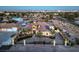 This beautiful home is shown from an aerial view that highlights its circular driveway and desert landscaping at 2780 El Camino Rd, Las Vegas, NV 89146